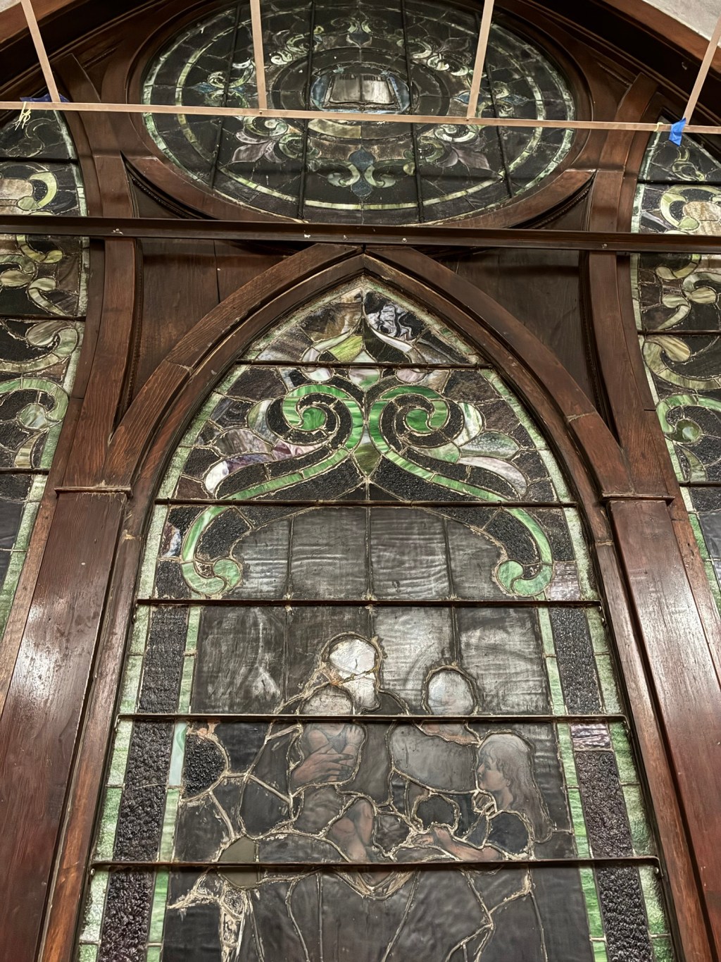 stained glass windows surrounded by dark wood
